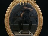 a man taking a picture of himself in a mirror