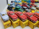 a lot of toy cars that are sitting on a table