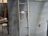a ladder leaning up against a wall in a room