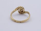 an image of a yellow gold ring with a diamond in the center