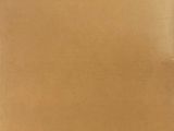 a brown piece of cardboard sitting on top of a wooden table