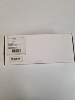 an open white box with a black and white sticker on it