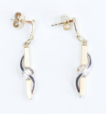 two tone gold and silver earrings with a twist design