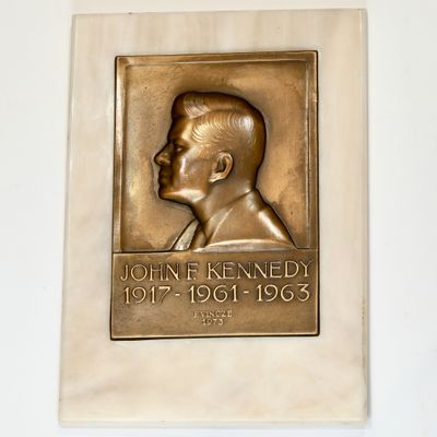a plaque with a picture of a man on it