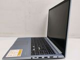an open laptop computer sitting on top of a white table