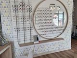 a picture of a store with a lot of glasses on the wall