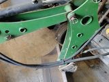 a green machine that is sitting on the floor