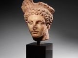 a roman marble head of a woman