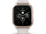 a white smart watch with a black face on a white surface