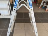 a picture of a ladder in a garage that has been painted blue and white