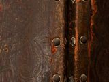 a close up of a leather case with rivets on it
