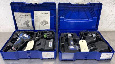 two blue boxes with tools in them on a table