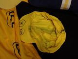 a yellow hat sitting on top of a yellow jacket