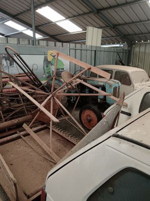 a truck that is parked next to a pile of wood