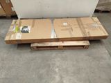 a pallet with two boxes on it in a warehouse