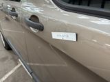 a close up of a car door handle with a sticker on it