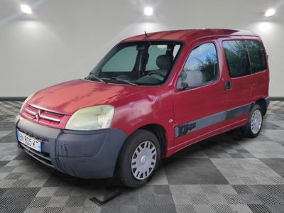 a red van that is parked on a checkered floor