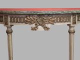 a small table with a marble top on a grey background