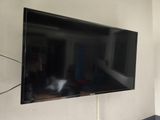 a flat screen tv mounted on a wall in a room