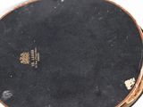 an image of a close up of a drum on a white surface