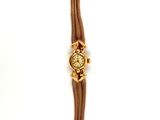 an image of a gold watch with a chain around it