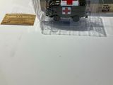 a box with a red cross on it sitting on a table
