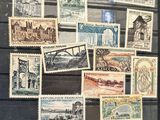 a picture of a collection of stamps on display in a glass case