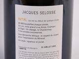 a bottle of wine sitting on a table with a label on it