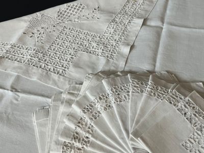 a lot of doily on a table with a fan
