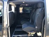 a small van with two seats in the back of it