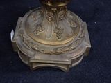 a gold vase sitting on top of a table