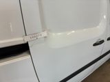 a white van with a sticker on the side of it