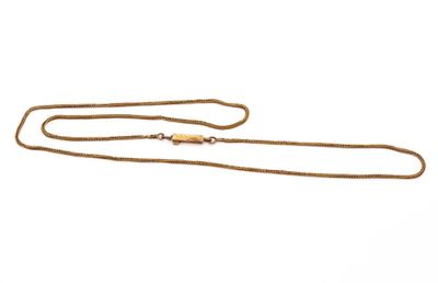 a close up of a gold necklace with a chain on a white background