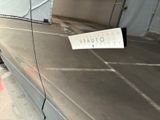 a sign on the side of a car that is parked in a garage