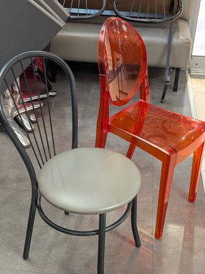 two chairs sitting next to each other in a room