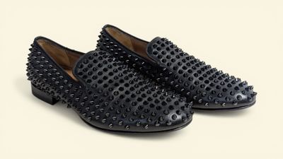 black studded loafer shoes on a white background