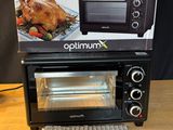 a box of food sitting on top of a counter next to a toaster oven