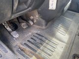 a close up of a car ' s floor with a car ' s pedals
