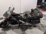 a picture of a motorcycle parked on a checkered floor