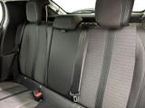 the back seats of a car with two rows of seats in it
