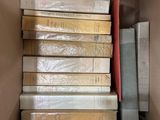 a box full of books sitting on top of each other