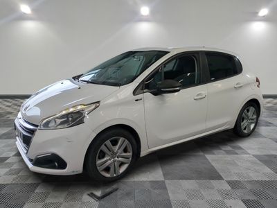 a picture of a white car parked in a showroom