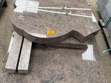 many pieces of granite on the ground in a warehouse