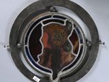 a picture of a picture of a woman in a hat on a ship wheel
