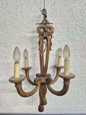 an image of a chandelier with three lights hanging from it ' s ceiling