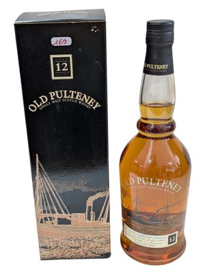a bottle of old pultenen whisky next to a box