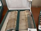 a lot of spoons and spoons in a box