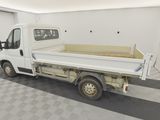 a white truck that is parked in a garage