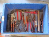 many different tools in a blue box on the floor