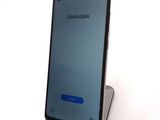 an image of a smartphone with a blue screen sitting on top of a table